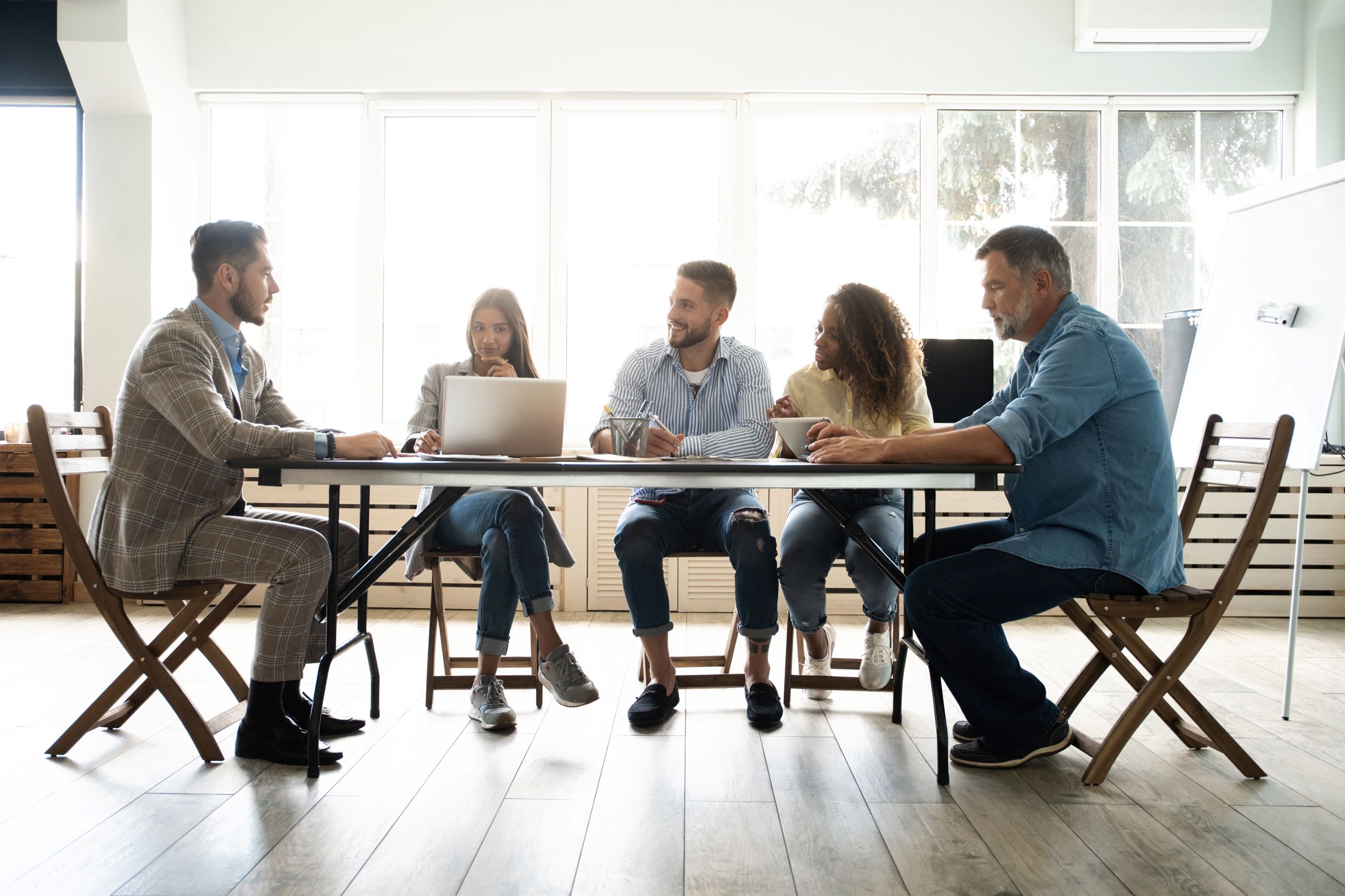 People sitting around a conference table